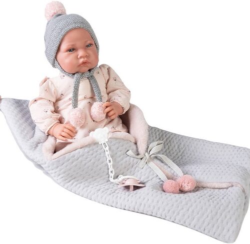 Neonata con coperta  e pon pon